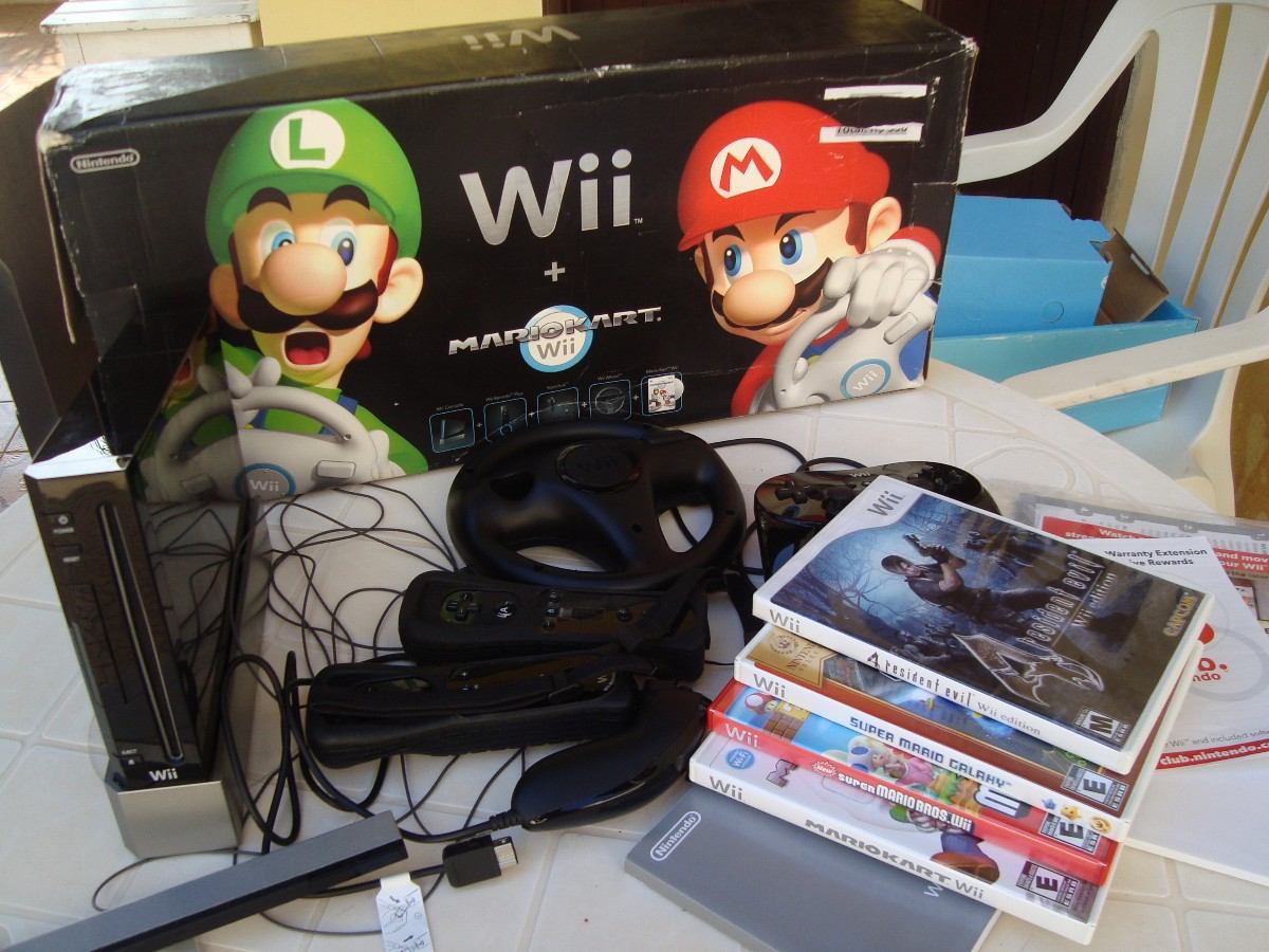 Wii com dois jogos do super mario e acessorios